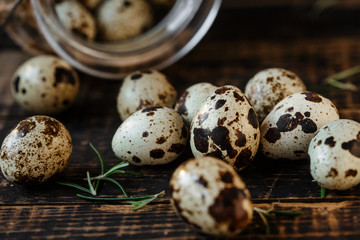 Quail eggs on wooden background. Symbol of the Easter season. Healthy Eating