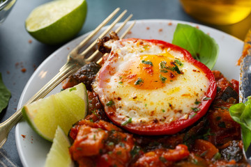 Fried egg with vegetables on plate