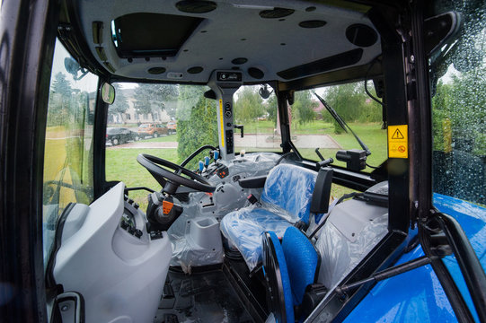 Bilohir'ya, Khmelnytsky region, Ukraine - August 15, 2019: Presentation of agricultural technology - New Holland, new blue tractor T5.110S at agro exhibition FARM DAY.
