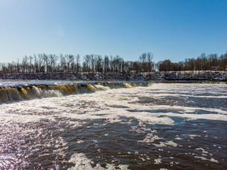 Warm winter day view of Ventas rumba riverfall, the wides waterfall in whole Europe.