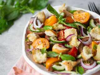 Tuscan Panzanella, traditional Italian salad with tomatoes and bread, basil. Mediterranean healthy food.