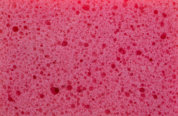 Pink color sponge texture background, close up view