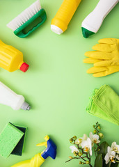 Cleaning products background, detergent bottles and tools