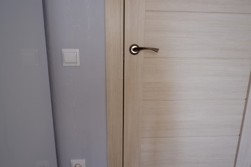 Stylish door handle in the room. Interior design.