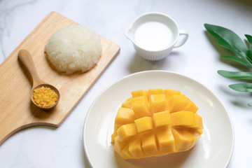 Thai sweet sticky rice with mango. Thai style tropical dessert, glutinous rice eat with mango.