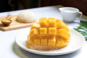 Thai sweet sticky rice with mango. Thai style tropical dessert, glutinous rice eat with mango.