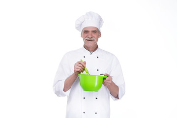 Cooking, profession and people concept, happy male chef cook holding bowl and whipping something with whisk
