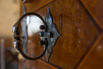 old iron knob, on a wooden door
