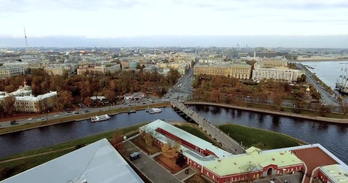 Saint Petersburg, Russia, panoramic aerial view of Petropavlovskaya Fortress and Neva river. Stock footage. Vasilyevsky Island, bridges of St. Petersburg, travel to Russian city.