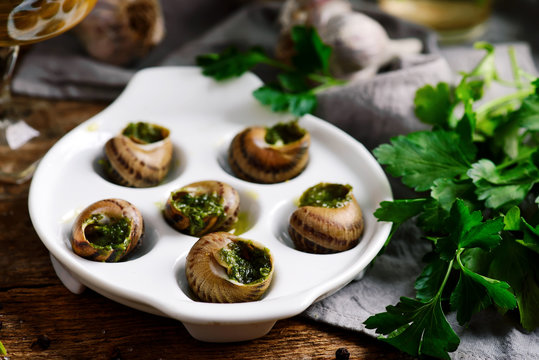 Burgundy escargot with herb butter.style rustic. - Powered by Adobe