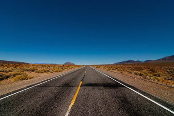 The road passing through the desert.