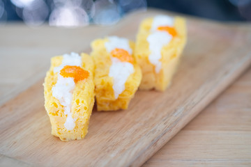 Grilled tamago sushi with rice and ebiko