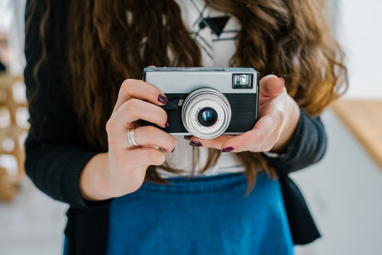 Woman photographer with old lomo camera.