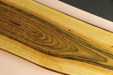 Minimalistic wooden texture . Wooden texture with grey, nude background. Minimalistic texture with wood and colors in a kitchen.