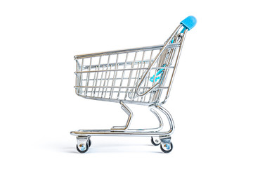 Empty shopping cart close-up isolated on a white background. Consumerism, sale and shopping concept.