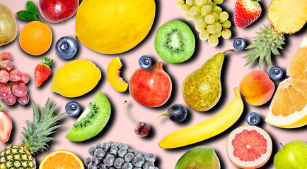 Creative photo of many different exotic tropical bright fruits with shadows on a pink color summer background. View from above. Bright summer fruit pattern.
