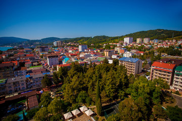 Fototapeta premium Beautiful panoramic autumn landscape at the resort city of Sochi on the Black sea coast. The view from the top.