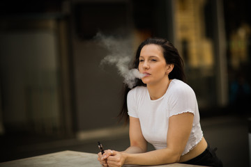 a young woman enjoying a vape