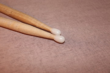 Drumsticks close up on a soft material