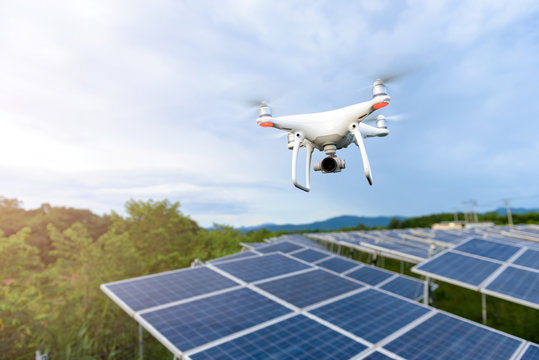 Drones flying over solar cells