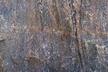 Obraz premium Texture of natural rock granite natural rock granite, magmatic structure with quartz and mica and traces of erosion.