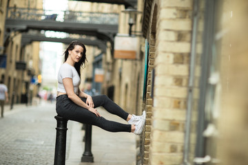 young woman posing in the street