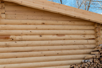 new wooden house made of round logs.