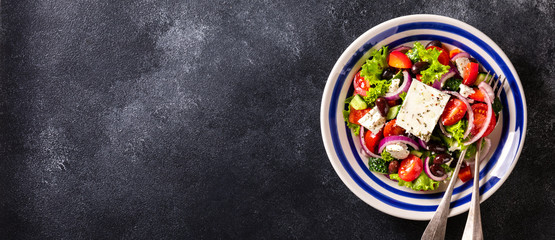 Greek salad of fresh vegetables, olives and feta. Traditional Mediterranean food.