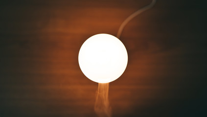 Diffuser aroma lamp on wooden table