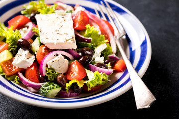 Greek salad of fresh vegetables, olives and feta. Traditional Mediterranean food.