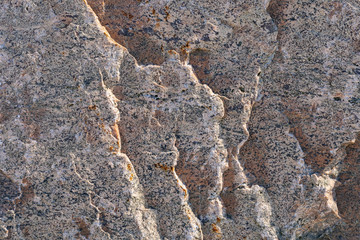Texture of natural rock granite natural rock granite, magmatic structure with quartz and mica and traces of erosion.