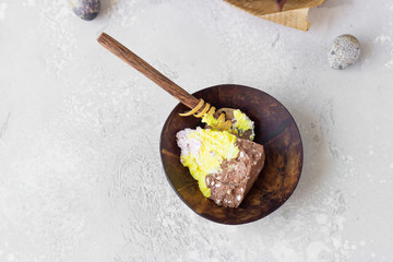 Layered paskha with chocolate, berries and curcuma. Traditional Russian or Ukrainian orthodox Easter quark dessert. Easter food background. 