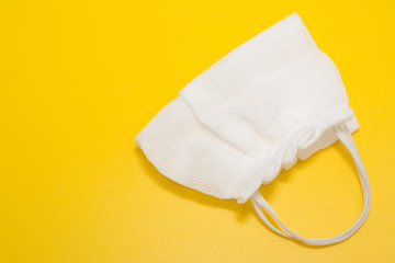 home-made medical mask made of a medical bandage to protect against bacteria during breathing and coronavirus COVID-19