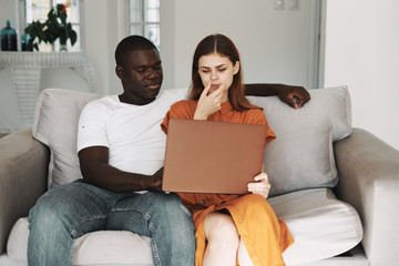 young couple using laptop