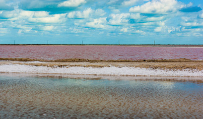 pink ponds, huge salt evaporation ponds for sea salt extraction with micro organisms turning the...