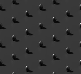 Many black chicken eggs with shadow on black isometric seamless background.