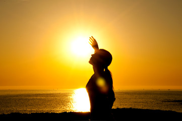 Woman silhouette in the sun