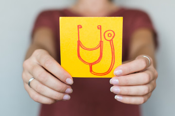 Picture icon in the hands stethoscope