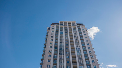 Fototapeta premium facade of a residential building fragment low angle view against the sky