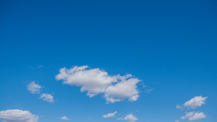 clear blue sky with white clouds on a clear day