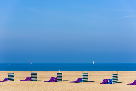 Windbreaker And Deckchairs On Ostend Beach, Belgium