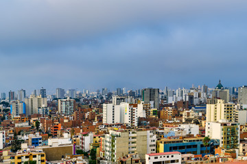 Skyscrapers and many houses in the city of Lima in Peru
