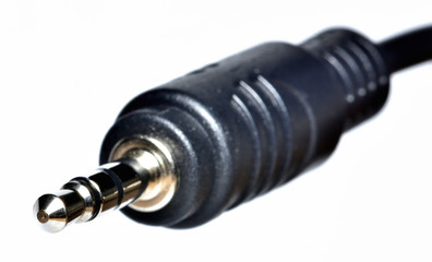 Close-up of 3.5mm jack connector isolated on white background.