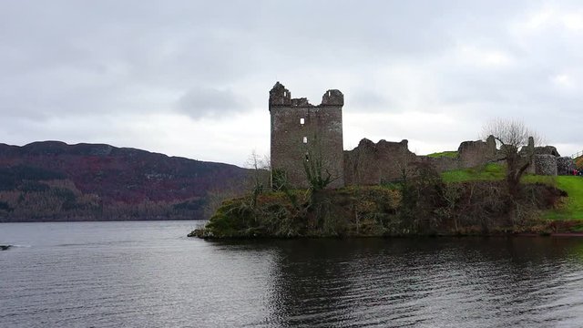 Scenic view of the tower of Urquhart Castle from the Loch Ness waters, looking for the Monster, Nessie. Jacobites historic site.  Inverness, Scotland, United Kingdom, UK.