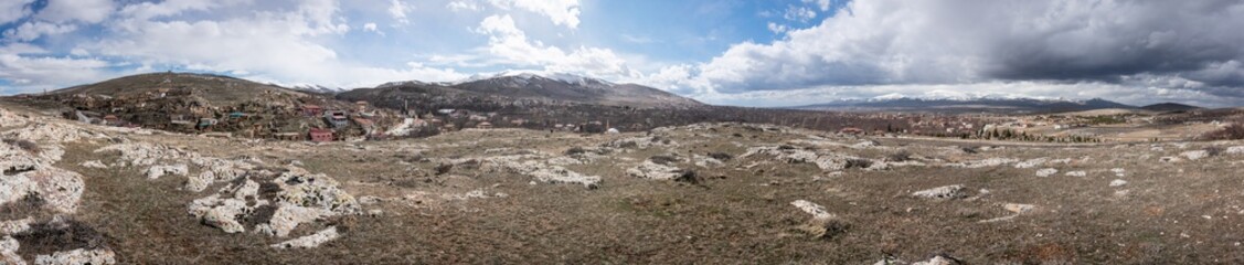 panoramic views of hills and mountains in a cloudy day