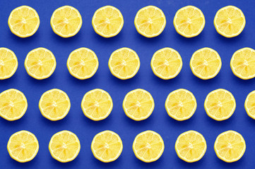 Patron of lemon slices on dark blue background