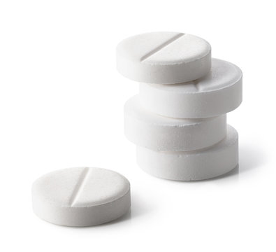 Stack of white round pills or tablets