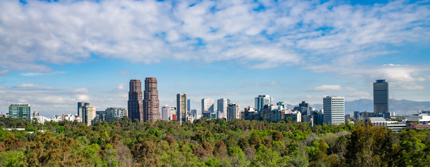 Panoramic view of Mexico city skyline on sunny day.