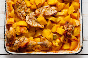Baked potato with chicken cooked in an electric oven. Background for cooking.