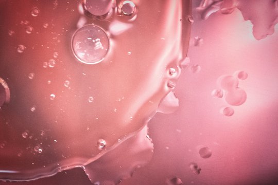 Overhead Macro Shot Of Pink Droplets On A Surface